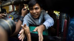 Reuters journalist Kyaw Soe Oo (C) talks to the media as he leaves after a court appearance in Yangon on January 10, 2018.
Myanmar police formally filed charges on January 10 against two Reuters reporters accused of breaching the Official Secrets Act, a judge said, an offence that carries up to 14 years in prison. / AFP PHOTO / YE AUNG THU        (Photo credit should read YE AUNG THU/AFP/Getty Images)