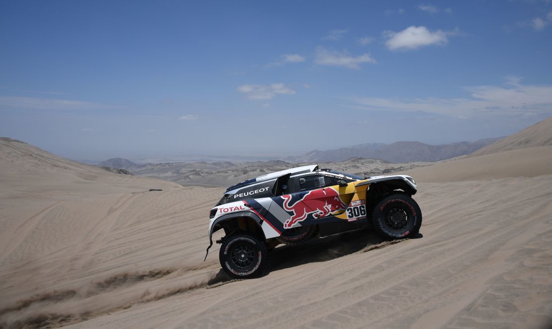 Peugeot's French driver Sebastien Loeb and co-driver Daniel Elena compete during the Stage 4 of the 2018 Dakar Rally in and around San Juan de Marcona, Peru, on January 9.