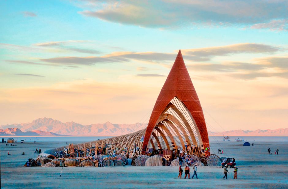 Designed by Jazz Tigan, the lobed spire at the opening of 2015's Temple of Promise was 97-feet high, while the tail of the building curled inwards around an open-air grove with bare trees. 