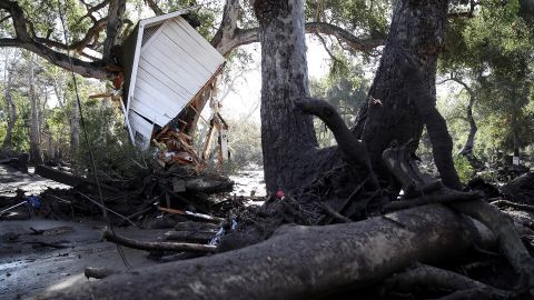 Part of a structure sits in a tree after being knocked off its foundation by a Montecito mudslide on January 10, 2018.