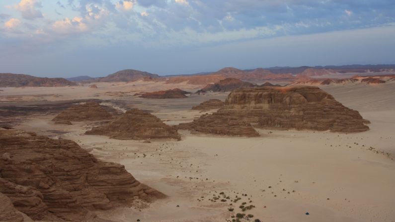 <strong>From sandstone to sand:</strong> Years of wind and weather have transformed this sandstone plateau into a landscape of powdery dunes and peaks. 