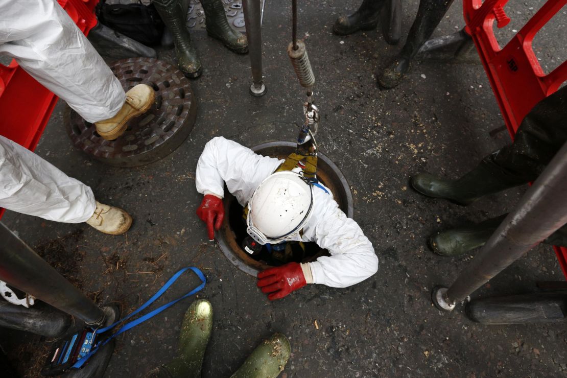 A Thames Water sewer engineer working on a fatberg in London in 2014.