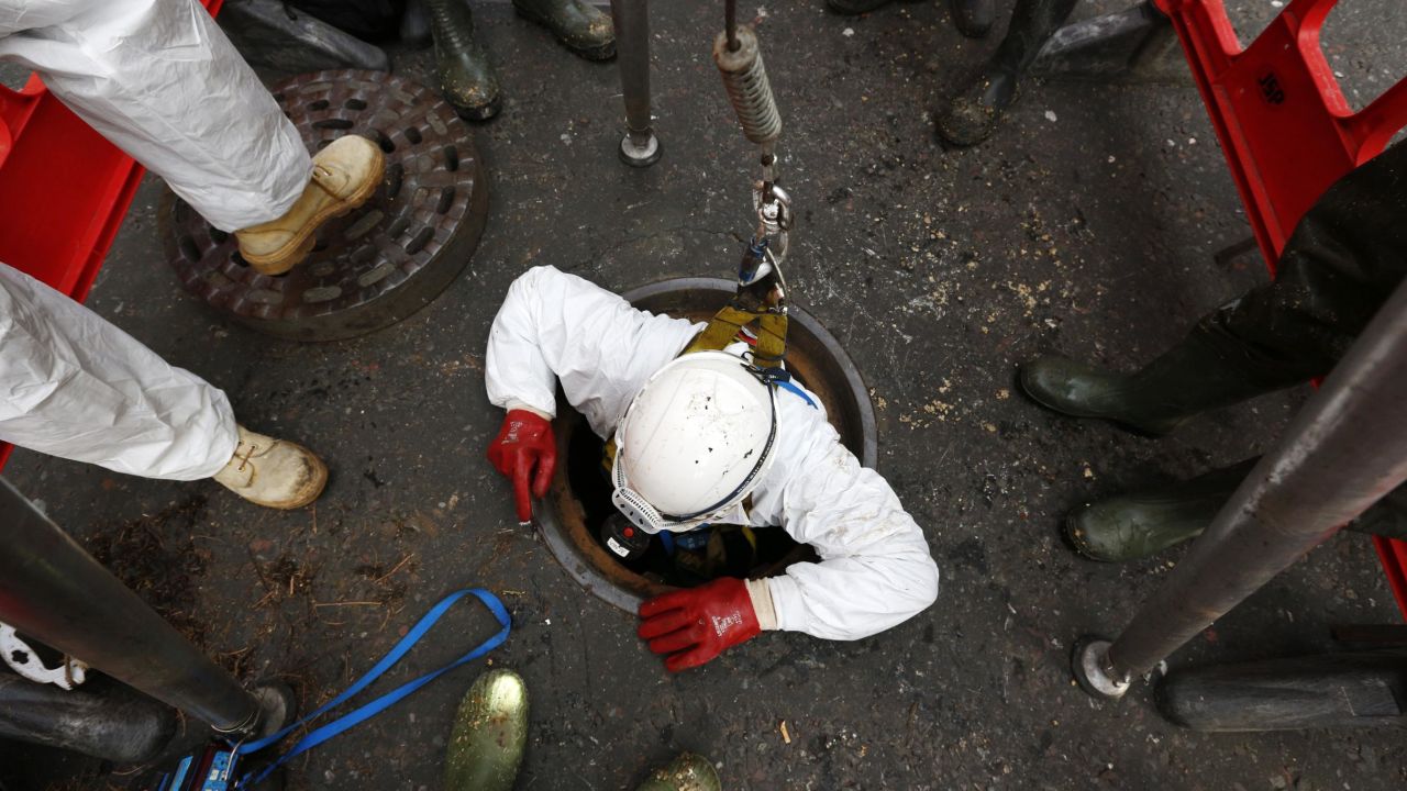 A Thames Water sewer engineer working on a fatberg in London in 2014.