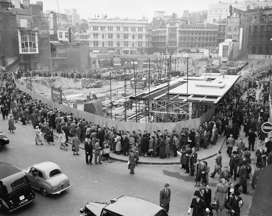 People queue to see the remains of the temple in 1954.