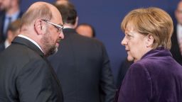 epa05073068 President of the European Parliament Martin Schulz (L) and German Chancellor Angela Merkel (R) during a family picture at the start of an EU Summit in Brussels, Belgium, 17 December 2015. EU leaders meet in Brussels for its year-end summit with highly controversial British demands for reforms expected to be discussed. Sanctions against Russia, Europe's migration crisis, the fight against terrorism and the crisis in Syria are also expected to round out the agenda of the two-days summit on 17 and 18 December. POOL EPA/ STEPHANIE LECOCQ  EPA/STEPHANIE LECOCQ