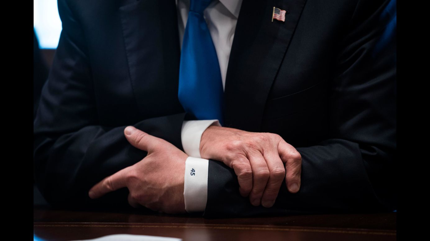 The No. 45 is seen on the shirt cuffs of US President Donald Trump as he meets with lawmakers in Washington on Tuesday, January 9. Trump is the 45th US President.