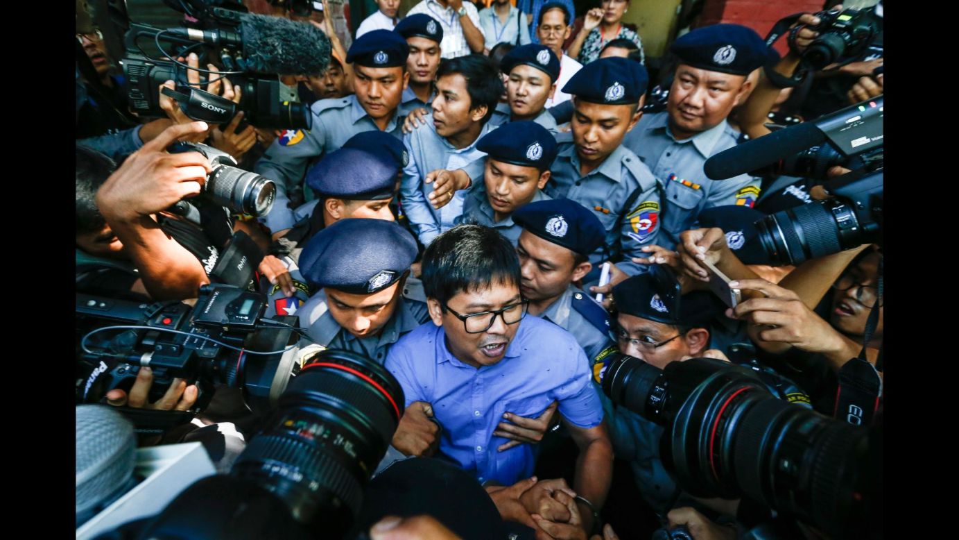 Reuters journalists Wa Lone, center front, and Kyaw Soe Oo, center back, are escorted by police as they leave a courtroom in Yangon, Myanmar, on Wednesday, January 10. <a href="http://www.cnn.com/2018/01/10/asia/reuters-journalists-myanmar-intl/index.html" target="_blank">They were arrested last month</a> while working on stories about the Rohingya minority in Rakhine state, Reuters reported, citing the men's lawyers. In a statement to Reuters in December, the Myanmar government said the reporters had been detained after they "illegally acquired information with the intention to share it with foreign media." Reuters Editor-in-Chief Stephen Adler said the agency was "extremely disappointed" at what he termed an "wholly unwarranted, blatant attack on press freedom."