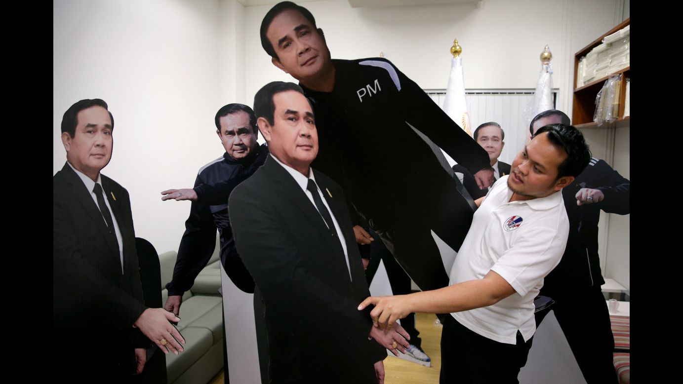 A government official in Bangkok, Thailand, arranges cardboard cutouts of Thai Prime Minister Prayuth Chan-ocha on Tuesday, January 9. Prayuth put a cutout of himself at a press event and told reporters to talk to it instead of him. <a href="http://www.cnn.com/videos/world/2018/01/09/thailand-prime-minister-cardboard-cutout-orig-jnd-vstan.cnn" target="_blank">See the video</a>