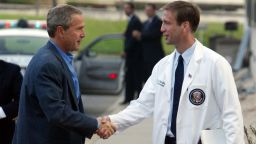 President Bush, left, is welcomed by Dr. Richard J. Tubb, physician to the president, at National Naval Medical Center in Bethesda, Md., Saturday, Aug. 2, 2003. President Bush is having his annual medical checkup. (AP Photo/Charles Dharapak)