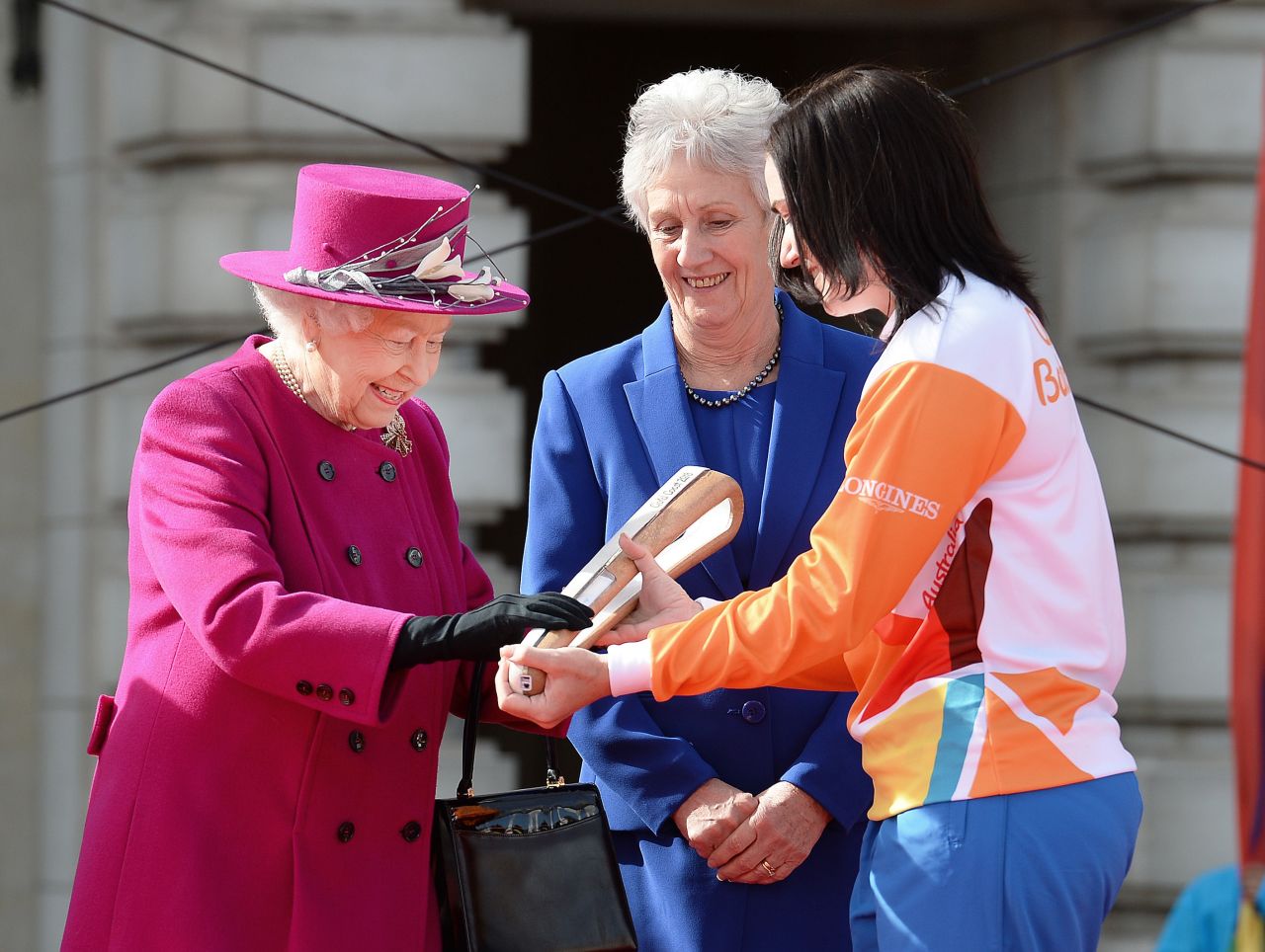 While not in attendance, her speech will be delivered from a written note inside the Queen's Baton Relay, which has traveled throughout the Commonwealth before the Games.