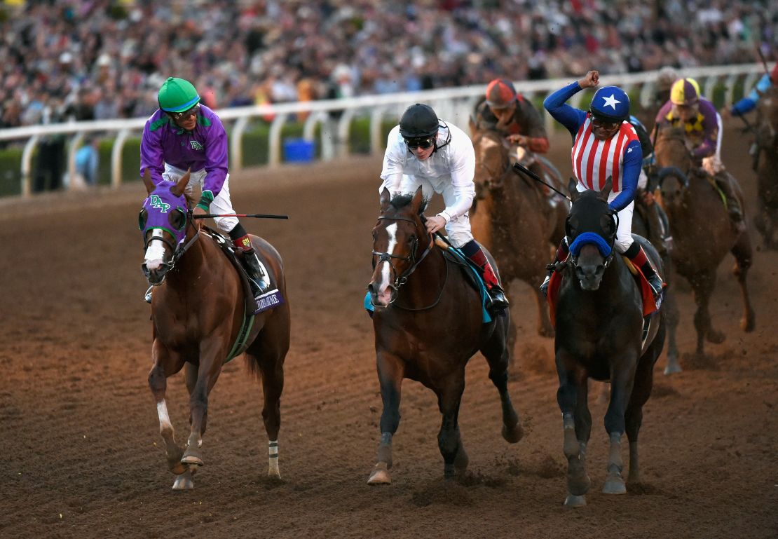 Toast of New York (center) finishes a nose behind winner Bayern (right) with California Chrome (left) third in the 2014 Breeders' Cup Classic.