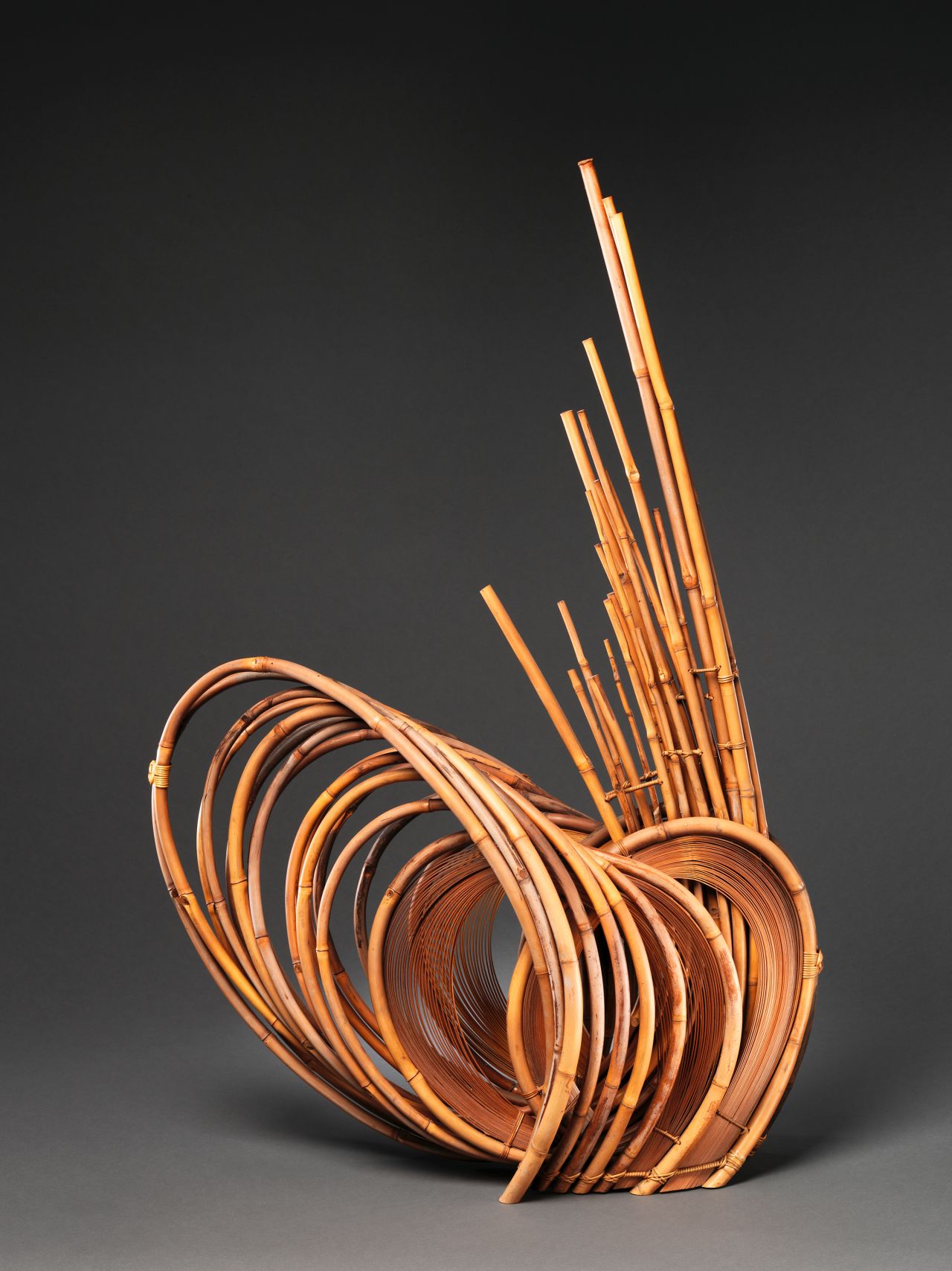 A sculptural piece made from smoked dwarf bamboo, dyed timber bamboo and rattan, a type of palm.