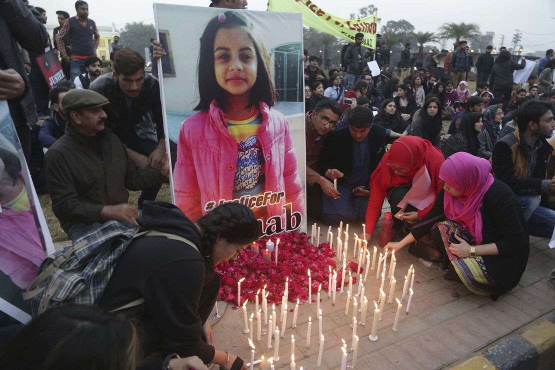 Pakistani students light candles during a protest rally to condemn the rape and killing of Zainab Ansari, an 8-year-old girl.