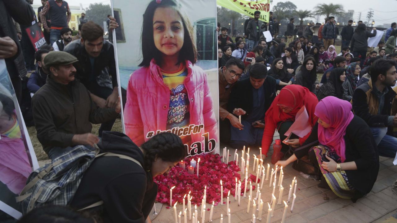 Pakistani students light candles during a protest rally to condemn the rape and killing of Zainab Ansari, an 8-year-old girl.