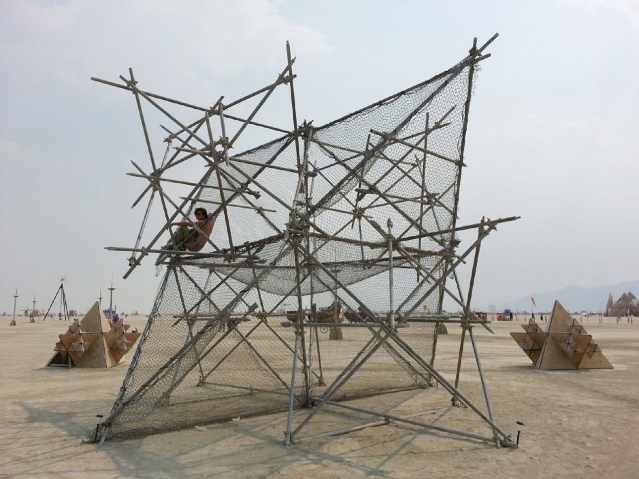 Fractal Cult, an installation for the 2013 Burning Man, was designed by Westminster University student Thanasis Korras. The geometry of the structures is strongly connected to Merkaba -- a vehicle of divine light used to transport the body and spirit to another dimension according to the Ancient Egyptian belief system.