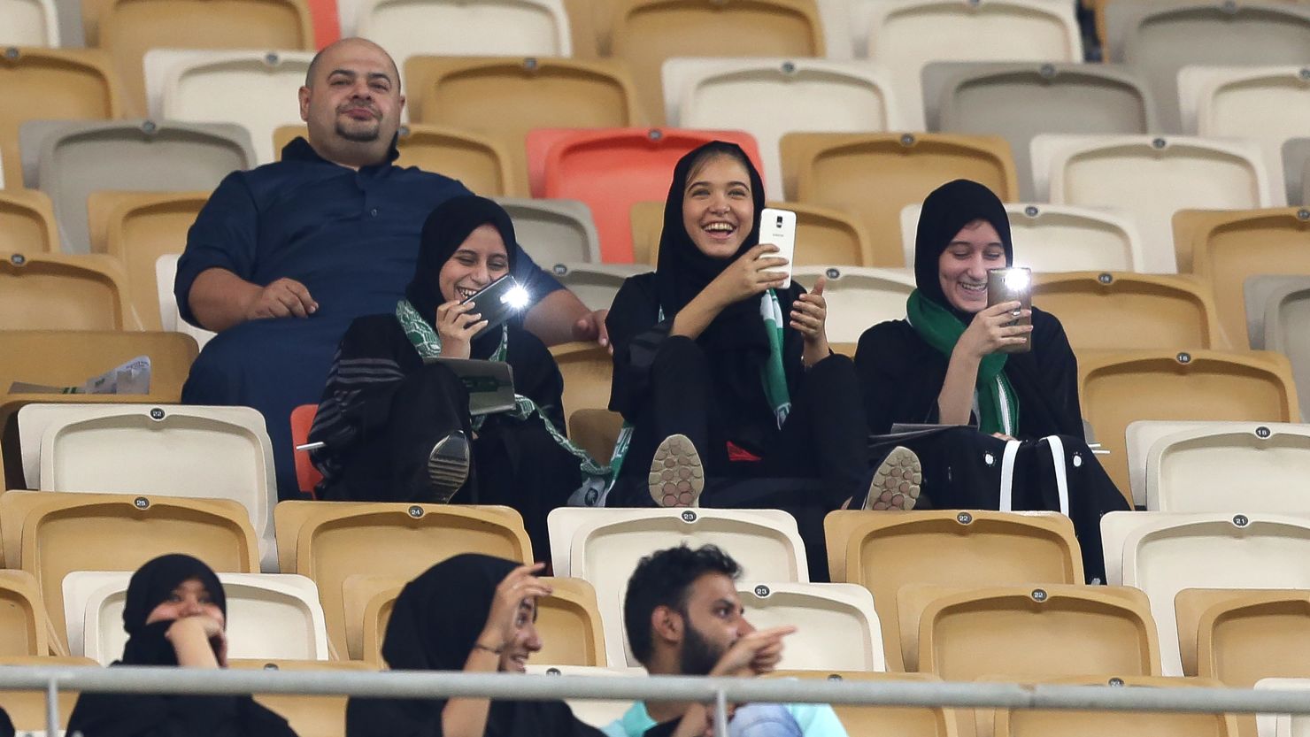 Female Saudi supporters of Al-Ahli attend their teams football match against Al-Batin in the Saudi Pro League at the King Abdullah Sports City in Jeddah on January 12, 2018.
Saudi Arabia will allow women to enter a football stadium for the first time to watch a match, as the ultra-conservative kingdom eases strict decades-old rules separating the sexes. / AFP PHOTO / STRINGER        (Photo credit should read STRINGER/AFP/Getty Images)
