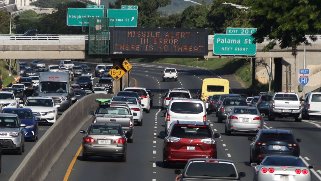 An electronic sign reads, "Missile alert in error. There is no threat."