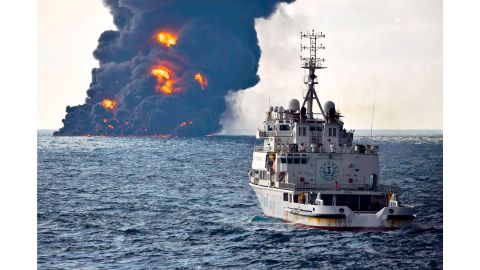 In this Sunday photo provided by China's Ministry of Transport, a rescue ship sails near the burning Iranian oil tanker Sanchi in the East China Sea.
