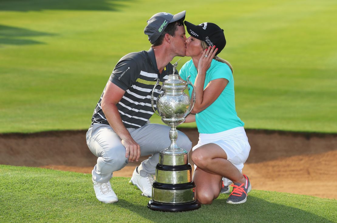 Chris Paisley kisses caddy and wife Keri after his victory during the South African Open Championship.