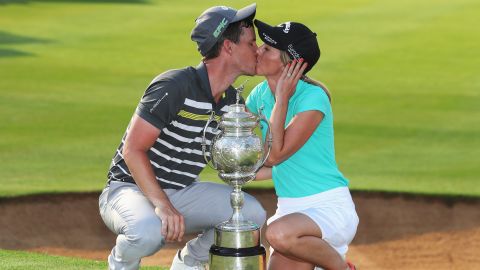 Chris Paisley of England kisses his wife Keri after winning the South African Open Championship.
