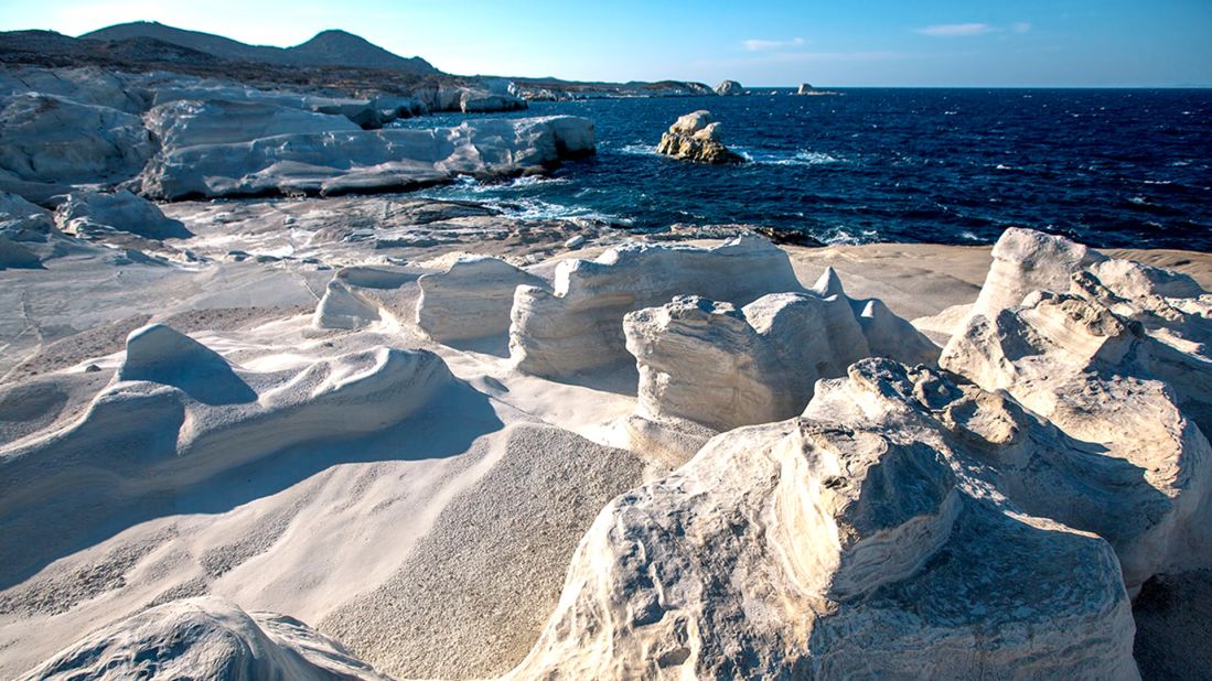 <strong>Sarakiniko: </strong>At Sarakiniko beach on the island of Milos bone-white contortions of bleached rock, shaped and smoothed over time, create a striking contrast with the Aegean's sapphire seas and give the impression of Mediterranean moonscape.
