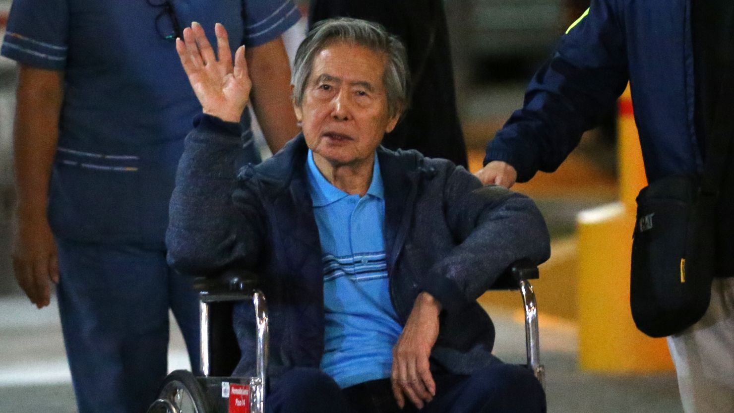 Ex-Peruvian President Alberto Fujimori is wheeled out of a Lima clinic in January after being hospitalized.