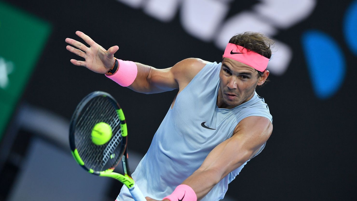 Spain's Rafael Nadal hits a return against Dominican Republic's Victor Estrella Burgos during their men's singles first round match on day one of the Australian Open tennis tournament in Melbourne on January 15, 2018. / AFP PHOTO / Greg Wood / -- IMAGE RESTRICTED TO EDITORIAL USE - STRICTLY NO COMMERCIAL USE --        (Photo credit should read GREG WOOD/AFP/Getty Images)