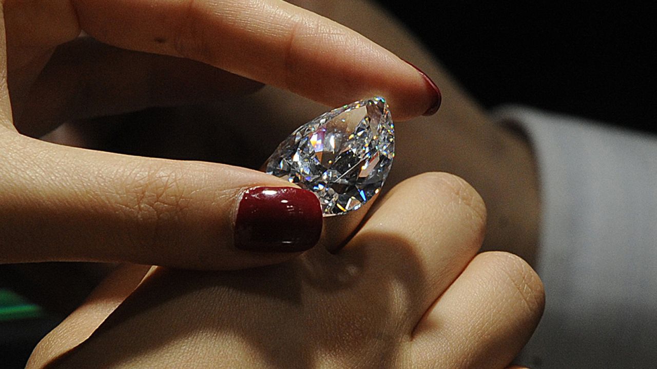 Real diamonds' color should be stronger when you look at it from the back, instead from the front.
