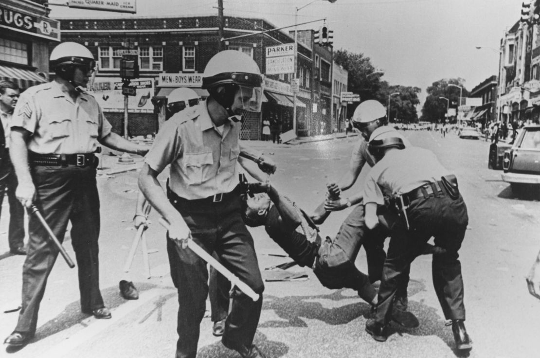 A man is carried away by police during riots in Baltimore, Maryland, in 1968. 