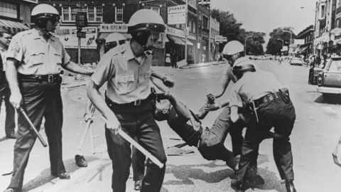 A man is carried away by police during riots in Baltimore, Maryland, in 1968.