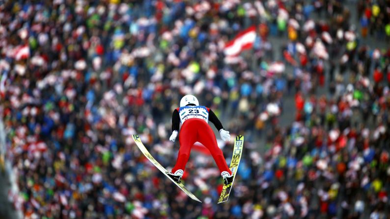 Switzerland's Simon Ammann soars through the air during the Ski Flying World Championships in Austria on January 13.