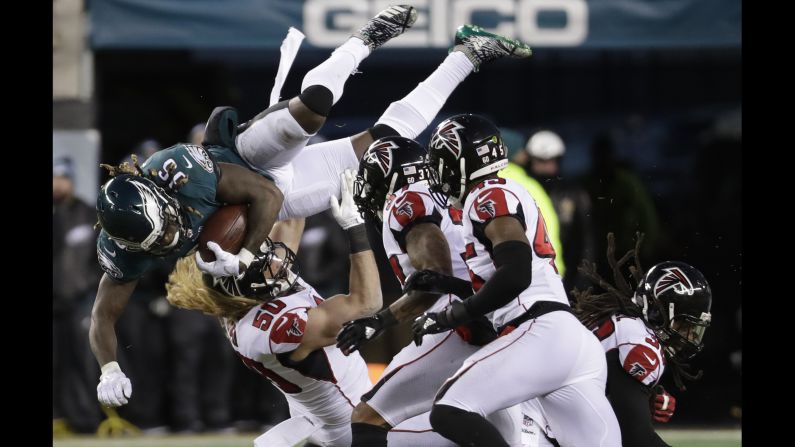 Philadelphia Eagles' Jay Ajayi is taken down by Atlanta Falcons' Brooks Reed, No. 50, during the first half of an NFL divisional playoff football game on Saturday, January 13.