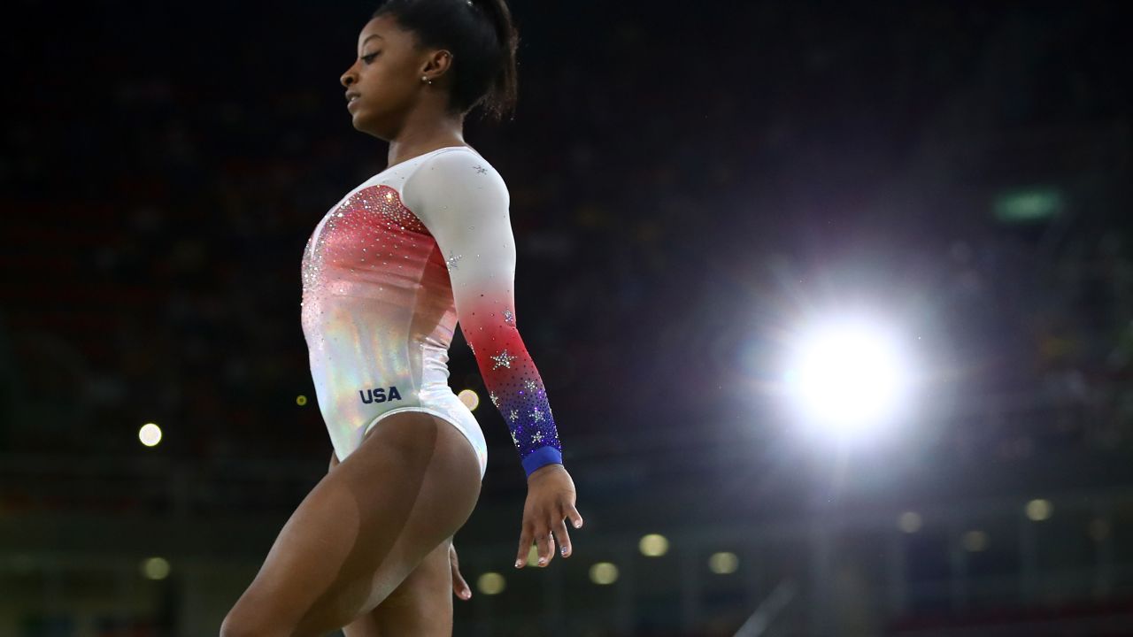 RIO DE JANEIRO, BRAZIL - AUGUST 17:  Simone Biles of the United States performs on the beam during the Gymnastics Rio Gala on Day 12 of the 2016 Rio Olympic Games on August 17, 2016 in Rio de Janeiro, Brazil.  (Photo by Clive Brunskill/Getty Images)