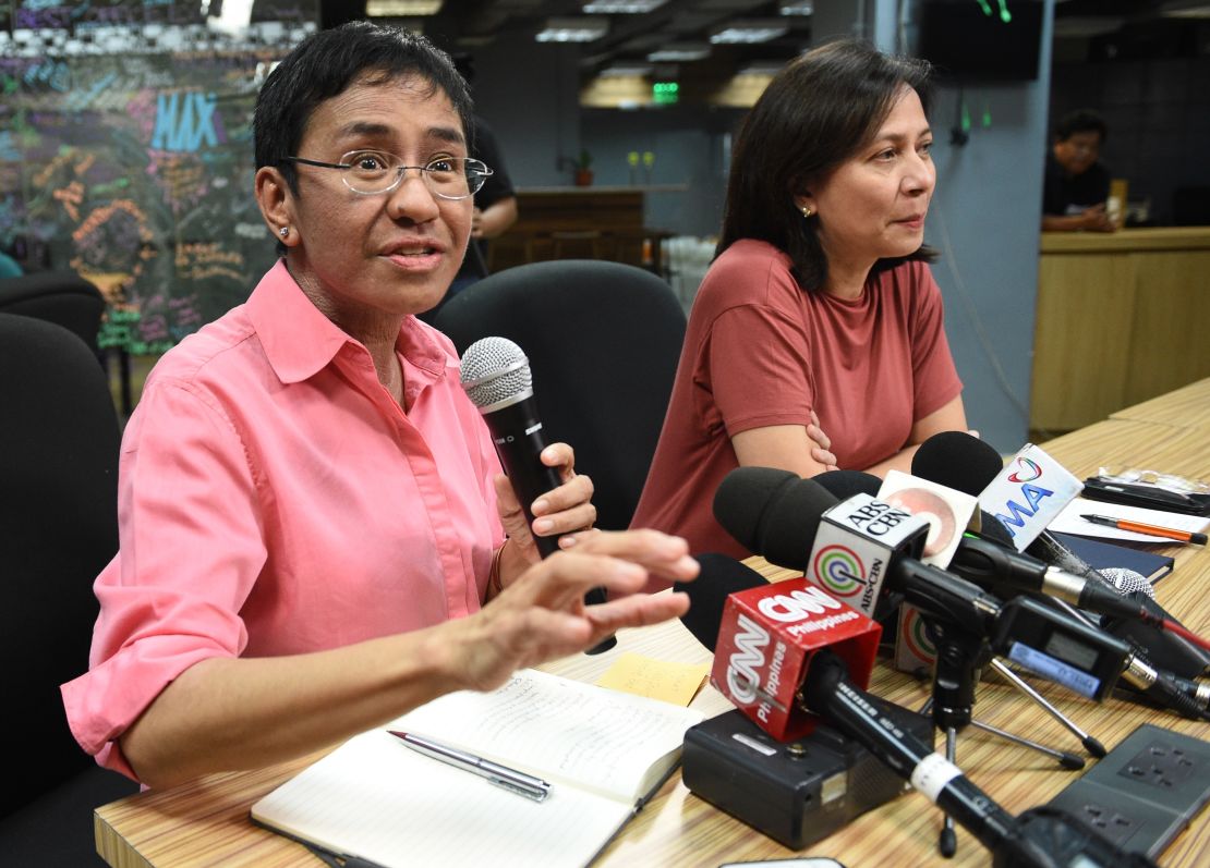 Rappler CEO and editor Maria Ressa speaks during a press conference at their office in Manila on January 15, 2018, while acting managing editor Chay Hofilena (R) listens. 