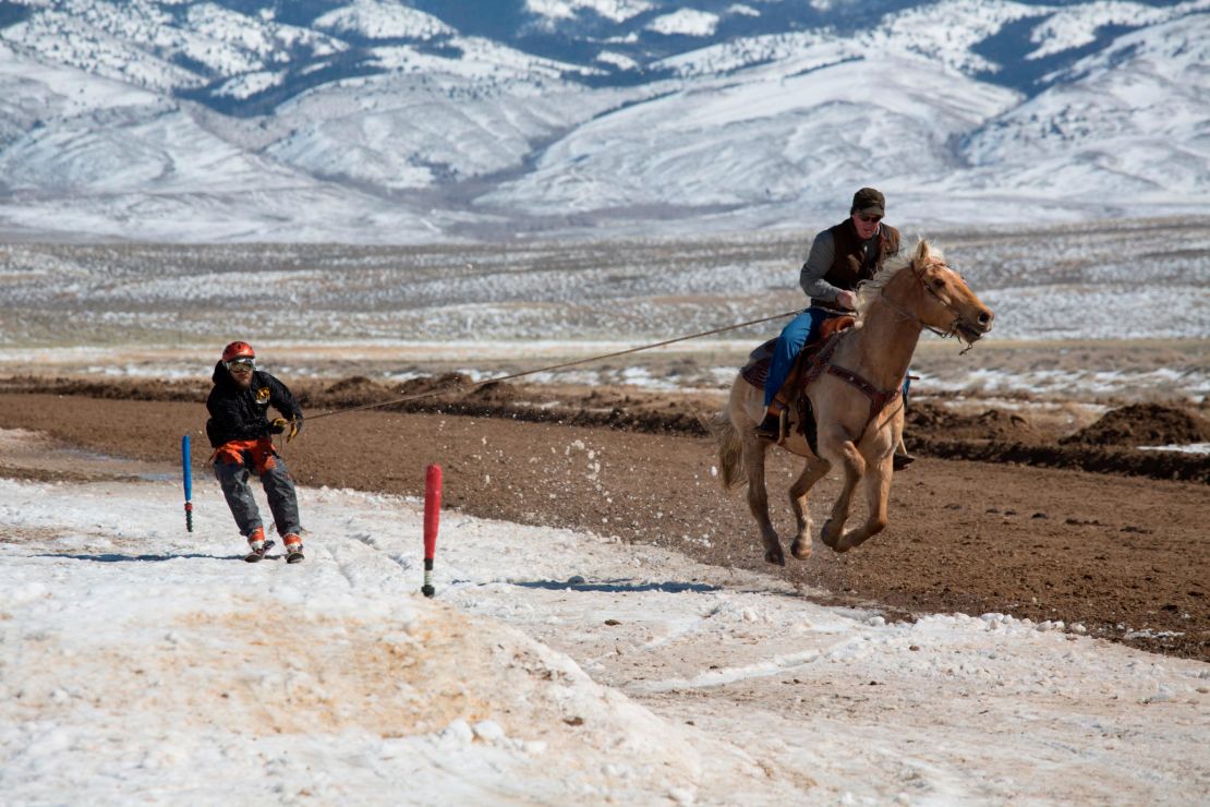 Horse, skier, and rider get to grips with the course in Saratoga, Wyoming.