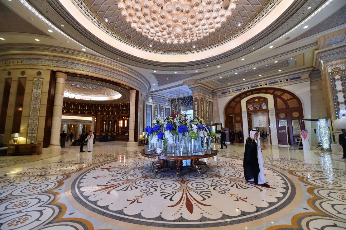 US and Saudi officials walk in the hallway of the hotel in May last year during US President Trump's visit.