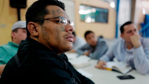 An ex-Barrio 18 gang member listens to a sermon at a church that welcomes former gang members into the congregation. 