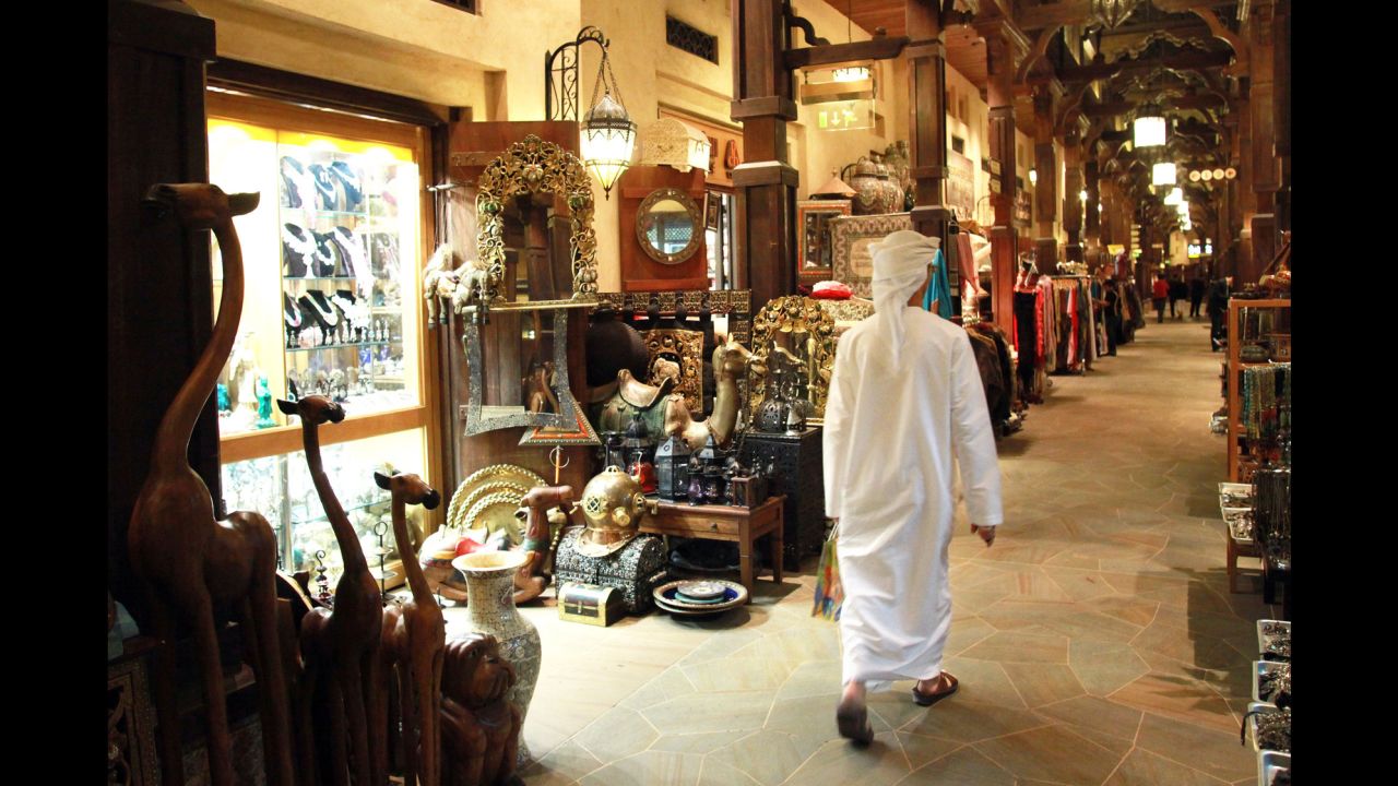 A visitor walks through the Souk Madinat, a marketplace with craft shops inside the Madinat Jumeirah resort.