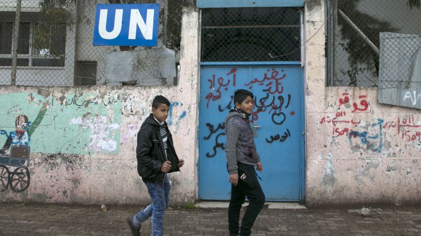 Palestinian children walk outside of the United Nations' school in the Askar refugee camp, near Nablus in the Israeli occupied West Bank, on January 17, 2018 after the White House froze tens of millions of dollars in contributions.
The agency provides Palestinian refugees and their descendants across the Middle East with services including schools and medical care, but Prime Minister Benjamin Netanyahu has long accused it of hostility toward Israel and called for its closure. / AFP PHOTO / JAAFAR ASHTIYEH        (Photo credit should read JAAFAR ASHTIYEH/AFP/Getty Images)