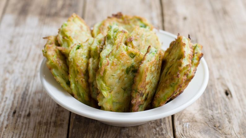 <strong>Zucchini fritters:</strong> The zucchini fritter is yet another delicious byproduct of immigration. Depending on who you ask, they're either Turkish and served with yogurt, or Greek, in which case they come with tzatziki sauce.
