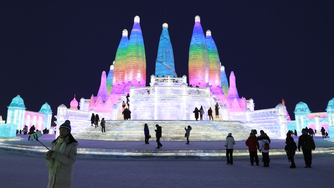 <strong>Ice and Snow World, Harbin, Heilongjiang Province, China:</strong> Visitors admire stunning, illuminated ice sculptures in the Ice and Snow World section of the 34th Harbin International Ice and Snow Sculpture Festival. 