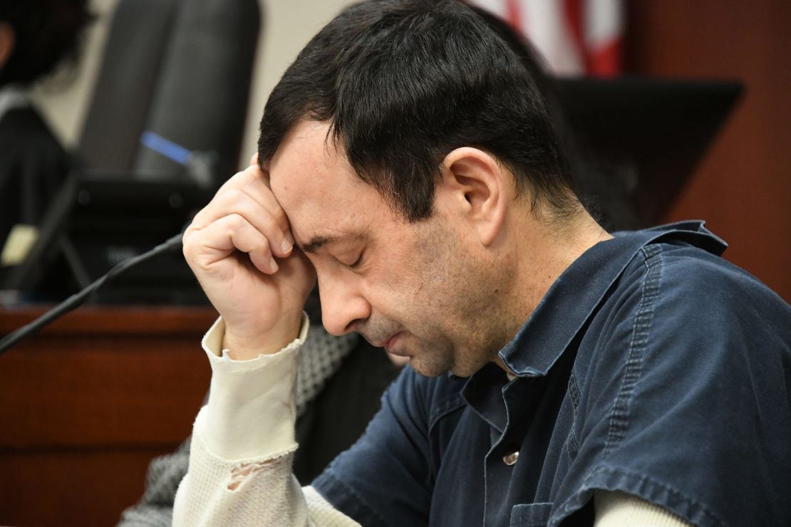 Larry Nassar listens as a victim makes her impact statement during this week's sentencing hearing.