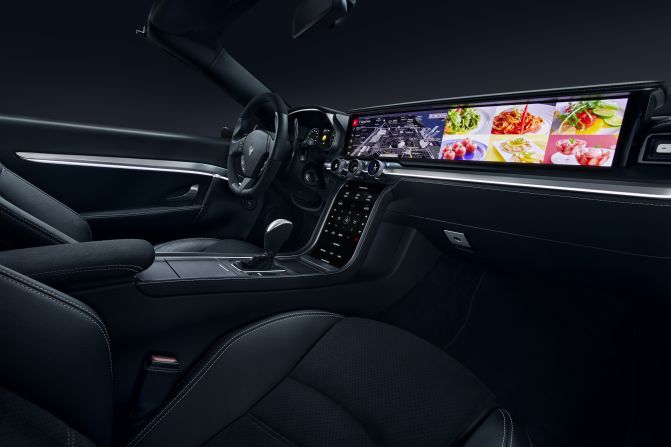 Harman's concept dashboard uses a 28-inch QLED widescreen display - although it can slide down into the fascia for a more subtle "strip screen" effect when it's not needed. The set-up, which also uses OLED screens for the instrument panel, center console and three configurable rotary switches, is likely to provide inspiration to manufacturer design teams.