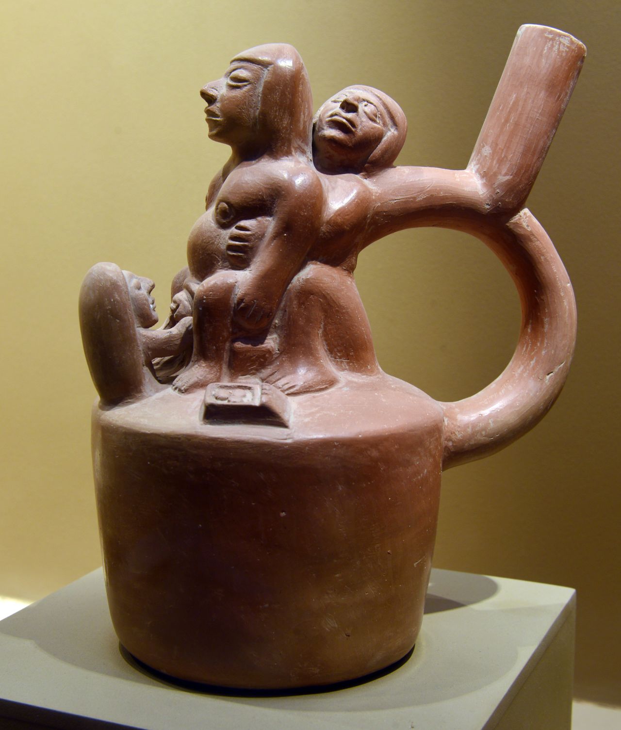 This piece of pottery, displayed at the Lord of Sipan Royal Tomb Museum, depicts a woman giving birth with the help of two other people. It is thought to have been made for educational purposes. 