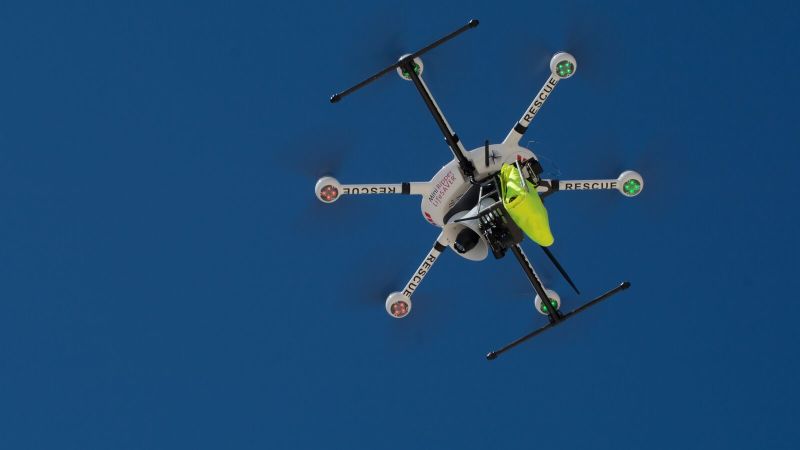 NextImg:New lifesaving drone rescues swimmers by dropping inflatable pod | CNN Business