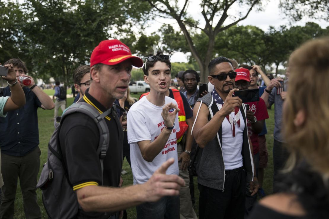 Pro-Trump supporters argue with an anti-fascist demonstrator at the "Mother of all Rallies" (MOAR) event on the National Mall in Washington, D.C., U.S., on Saturday, Sept. 16, 2017.