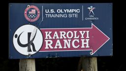 A sign points down the road to the Karolyi Ranch Saturday, Sept. 12, 2015, in New Waverly, Texas. (AP Photo/David J. Phillip)