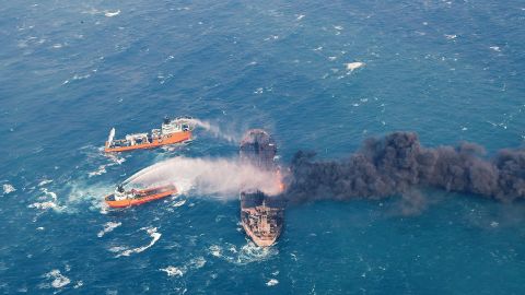 In this January 10 photo provided by China's Ministry of Transport, firefighting boats work to put on a blaze on the oil tanker Sanchi in the East China Sea off the eastern coast of China. 