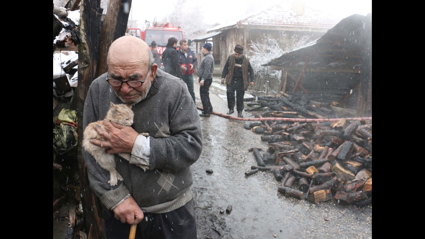 Ali Mese, 83, holds his cat after firefighters saved the animal in Bolu, Turkey, on Wednesday, January 17. Mese accidentally started a fire at his home while trying to light his heating stove with gasoline, <a href="https://www.dailysabah.com/life/2018/01/17/old-man-in-tears-hugs-beloved-cat-as-his-house-burns-down" target="_blank" target="_blank">according to Turkey's pro-government Daily Sabah newspaper</a>. 