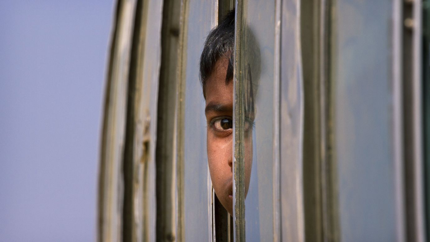 A Rohingya refugee peers out the window of a bus as he is brought to the Balukhali refugee camp in Bangladesh on Thursday, January 18.<br />Concerns are mounting over a joint plan from<a href="http://www.cnn.com/2018/01/17/asia/bangladesh-myanmar-rohingya-repatriation-plan-intl/index.html"> Myanmar and Bangladesh to repatriate hundreds of thousands of ethnic Rohingya</a> who fled violence in Myanmar's Rakhine state last year. The two countries plan to return more than 650,000 refugees in Bangladesh to Rakhine within two years, according to Bangladesh's Foreign Ministry.